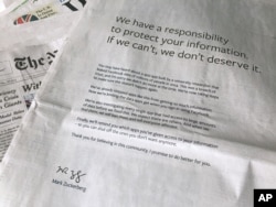 FILE - An advertisement in The New York Times is displayed on Sunday, March 25, 2018, in New York. Facebook’s CEO apologized for the Cambridge Analytica scandal with ads in multiple U.S. and British newspapers.