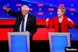 សមាជិក​ព្រឹទ្ធសភា លោក Bernie Sanders និង​លោក​ស្រី ​Elizabeth Warren ​ថ្លែង​ក្នុង​ការ​ជជែក​ដេញ​ដោល​យប់​ទី​១ នៃ​វគ្គ​ទី​២ ក្នុង​ការ​ដេញ​ដោល​ដើម្បី​បាន​បេក្ខភាព​របស់​គណបក្ស​ប្រជាធិបតេយ្យ នៅ​ទីក្រុង Detroit រដ្ឋ Michigan សហរដ្ឋ​អាមេរិក។