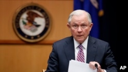FILE - U.S. Attorney General Jeff Sessions prepares to speak before a meeting at the Department of Justice in Washington, April 18, 2017. Sessions is to testify before lawmakers Tuesday.