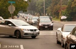 Cars jam the streets as residents evacuate Sonoma, California, Oct. 11, 2017. With fires getting near, the town was placed under a voluntary evacuation order.