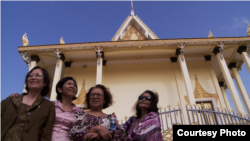 FILE: The three survivors, along with a Cambodian American professor Leakhena Nov, at the temple. (Courtesy Photo​ of Michael Siv)