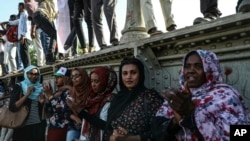 FILE - Sudanese women protesters are seen at a rally in Khartoum, April 23, 2019.