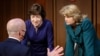 Homeland Security Secretary Alejandro Mayorkas, left, talks with Sen. Susan Collins, R-Maine, center, and Sen. Lisa Murkowski, R-Alaska, right, during a break of the Senate Appropriations committee hearing to examine domestic extremism, Wednesday,…