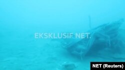 Debris, believed to be from Lion Air flight JT610 plane, which crashed, is seen during an operation by Navy divers near the search area off Tanjung Pakis, Indonesia, Oct. 31, 2018, in this still image taken from a video obtained from social media.