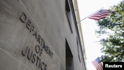 FILE - The exterior of the U.S. Department of Justice in Washington.