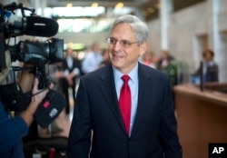 Judge Merrick Garland, President Barack Obama's choice to replace the late Justice Antonin Scalia on the Supreme Court, arrives for a meeting with Sen. Angus King, I-Maine, on Capitol Hill in Washington, April 13, 2016.