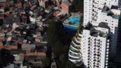 An aerial view shows the city's biggest slum Paraisopolis next to luxury apartment buildings in Sao Paulo, Brazil April 2, 2020.