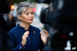 FILE - Mu Sochua, deputy leader of the Cambodia National Rescue Party (CNRP), the Cambodian opposition, speaks during an interview with Associated Press in London, Thursday, Nov. 16, 2017.