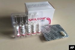 FILE - Tablets and vials of meldonium, also known as mildronate, are photographed in Moscow, March 8, 2016. Russian tennis star Maria Sharapova says she failed a drug test for meldonium at the Australian Open.