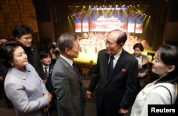 S. Korean President Moon Jae-in talks with president of the Presidium of the Supreme People's Assembly of North Korea Kim Young Nam as Kim Yo Jong, the sister of North Korea's leader Kim Jong Un.