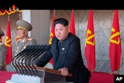 In this image made from video, North Korean leader Kim Jong Un delivers a speech during the ceremony to mark the 70th anniversary of the country's ruling party in Pyongyang, Oct. 10, 2015.