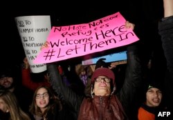 FILE - Demonstrators protest President Donald Trump's executive immigration ban at O'Hare International Airport in Chicago, Jan. 29, 2017.
