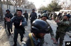 Security forces inspect the site of an Islamic State-claimed attack on a hospital in Kabul, Afghanistan, March 8, 2017.