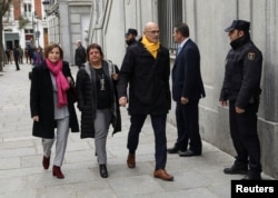 Catalan politicians (L-R) Carme Forcadell, Dolors Bassa and Raul Romeva arrive together to the Supreme Court after being summoned and facing investigation for their part in Catalonia's bid for independence in Madrid, Spain, March 23, 2018.