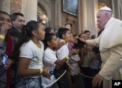Pope Francis blesses faithful during his visit to the Morelia Cathedral in Mexico's Michoacan state, Feb. 16, 2016.