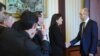 Ukrainian Prime Minister Arseniy Yatsenyuk (r) shakes hands with U.S. Senator Kelly Ayotte in Kyiv, March 23, 2014.