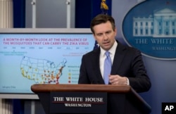FILE - White House press secretary Josh Earnest discusses Zika virus during the daily news briefing at the White House in Washington.