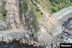 FILE - Landslides block State Highway One near Kaikoura on the upper east coast of New Zealand's South Island following an earthquake, Nov. 14, 2016. Facebook created maps after the earthquake to show where people were going in the days after the quake struck.