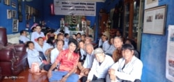 Mami Yuli (center, in red shirt) and elderly trans women pose for a photo at the FKWI shelter. (Courtesy - FKWI)