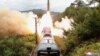 Sebuah rudal terlihat diluncurkan saat latihan Resimen Rudal Kereta Api di Korea Utara pada 16 September 2021. (Foto: KCNA via REUTERS)