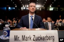Facebook CEO Mark Zuckerberg arrives to testify before a joint hearing of the Senate Commerce and Judiciary committees on Capitol Hill in Washington, April 10, 2018, about the use of Facebook data to target American voters in the 2016 election.