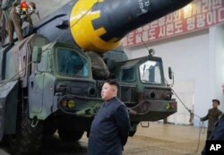 This image made from video of an undated still image broadcast in a news bulletin by North Korea's KRT, May 15, 2017, shows leader Kim Jong Un at what was said to be a missile test site at an undisclosed location in North Korea.