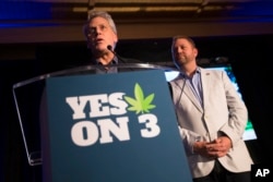 Jimmy Gould, co-founder of Responsible Ohio, a pro-marijuana legalization group, speaks to the crowd after a concession speech delivered by executive director Ian James, right, at an election night event at the Le Meridien hotel, Nov. 3, 2015.