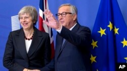 Tereza Mej i Žan Klod Junker
