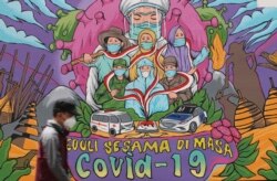 Mural kesadaran bahaya COVID-19 di Jakarta, 20 November 2021.