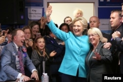 FILE - U.S. Democratic presidential nominee Hillary Clinton greets people at a campaign office in Seattle, Washington, Oct. 14, 2016.