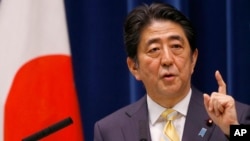 Japan's Prime Minister Shinzo Abe speaks during a press conference at his official residence in Tokyo May 14, 2015. (AP Photo/Shizuo Kambayashi)