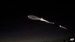 The contrail from a SpaceX Falcon 9 rocket is seen from Pasadena, Calif., about 150 miles east from its launch site in Vandenberg Air Force Base, Calif., Dec. 22, 2017. A reused SpaceX rocket has carried 10 satellites into space from California, leaving behind it a trail of mystery and wonder. 