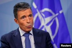 FILE - Secretary General Anders Fogh Rasmussen says NATO condemns Russia's 'continuing disregard' for Ukraine sovreignty.