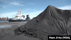 FILE - North Korean coal is shown after being unloaded at the Port of Pohang, South Korea.