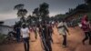 FILE - Militiamen, including alleged children, of an armed group from the Lendu community stand guard in Ituri Province, Democratic Republic of Congo, Sept. 19, 2020.