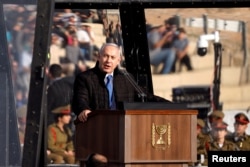 Israeli Prime Minister Benjamin Netanyahu speaks at the Israeli Air Force pilots' graduation ceremony at Hatzerim air base in southern Israel, Dec. 26, 2018.