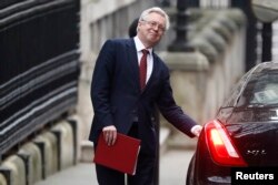Britain's Secretary of State for Departing the EU, David Davis, leaves Downing Street in London, Jan. 25, 2017.