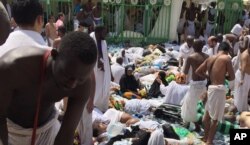 FILE - Muslim pilgrims gather around a group of victims of a stampede in Mina, Saudi Arabia, during the annual Hajj pilgrimage, Sept. 24, 2015. A total of 139 Indonisian nationals were killed in Hajj-related incidents that year.