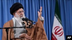 FILE - Ayatollah Ali Khamenei speaks at a meeting with a group of Revolutionary Guards and their families, in Tehran, Iran, April 9, 2019.