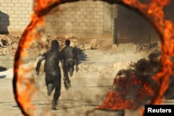 FILE - Rebel fighters attend military training in Idlib province, Syria, Oct. 27, 2016.