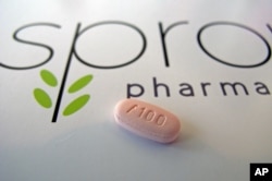 A tablet of flibanserin sits on a brochure for Sprout Pharmaceuticals in the company's Raleigh, N.C., headquarters.