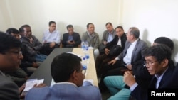 FILE - Myanmar delegates meet with Rohingyas at Kutupalong camp in Cox’s Bazar, Bangladesh, Dec. 19, 2019. 