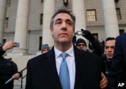 Michael Cohen walks out of federal court, Nov. 29, 2018, in New York, after pleading guilty to lying to Congress about work he did on an aborted project to build a Trump Tower in Russia.