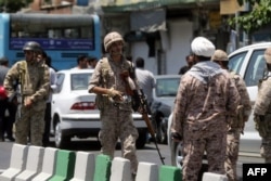 FILE - Members of the Iranian Revolutionary Guard are seen in Tehran, June 7, 2017.