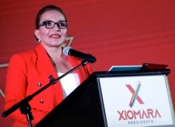 FILE - Xiomara Castro, presidential candidate for the opposition Libre Party, speaks to supporters during a rally in Tegucigalpa, Honduras, Sept. 5, 2021.