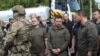 Presiden Ukraina Volodymyr Zelenskiy mengunjungi daerah banjir setelah bendungan Nova Kakhovka jebol, di tengah serangan Rusia terhadap Ukraina, di Kherson, Ukraina 8 Juni 2023.