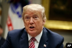 President Donald Trump speaks during a meeting with state and local officials to discuss school safety, in the Roosevelt Room of the White House, Feb. 22, 2018, in Washington.