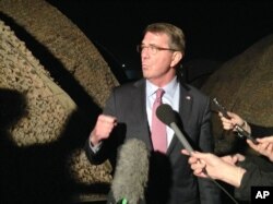 FILE - U.S. Defense Secretary Ash Carter told his Afghan counterpart Friday in Jalalabad, Afghanistan, that the U.S. is “with you,” committed to supporting Afghan security forces and building their capabilities for years to come. Carter is shown in Irbil, Iraq,
