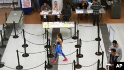 Voters walk through a polling station in Dallas, Texas, Nov. 8, 2016.