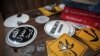 FILE - In this Oct. 13, 2014, photo, Islamic State group pins and stickers are seen on display at an Islamic bookstore in the Fatih district of Istanbul, Turkey.